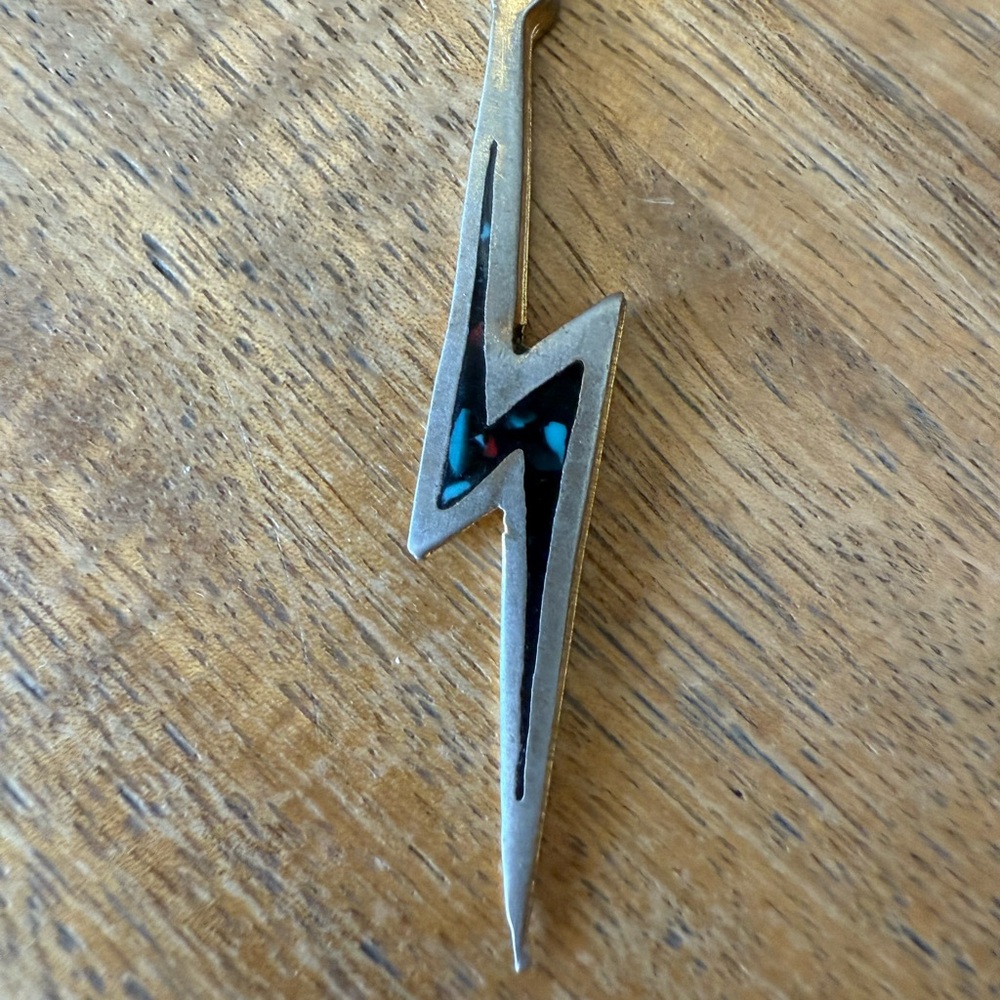 Vintage from the 80s 
Silver Lightning Bolt Pendant